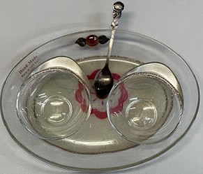 Charoseth and maror set with spoon on tray