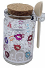 Glass decorated honey jar with spoon