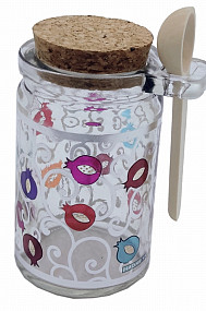 Glass decorated honey jar with spoon