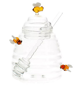 Glass honey jar with bees